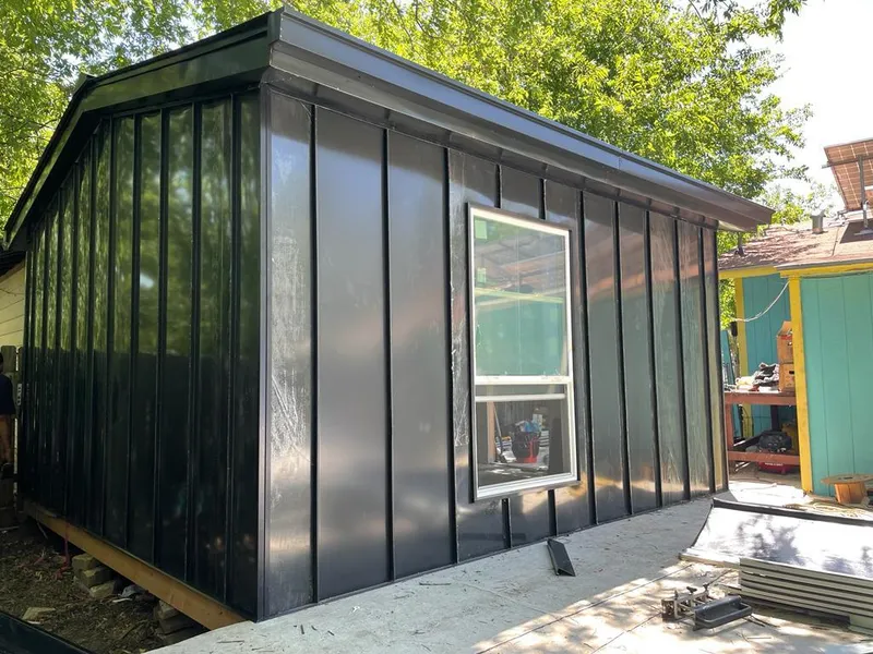 Black standing seam metal wall panels for Roof Inspection in Oak Park